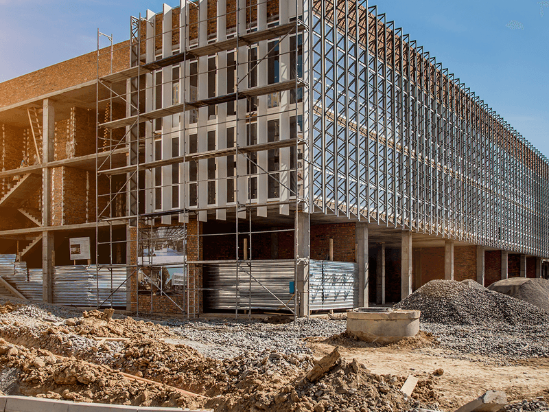 Workers reviewing construction plans
